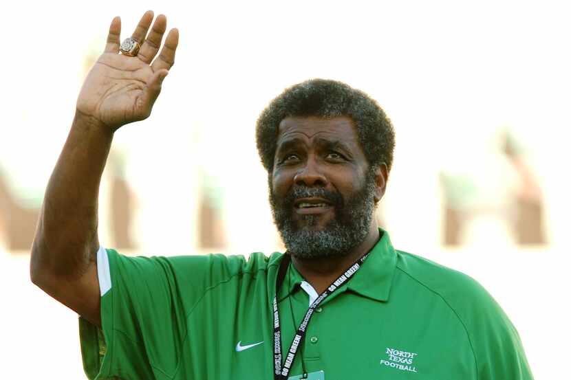 NFL hall-of-famer Mean Joe Greene waves to the crowd before kickoff as the University of...