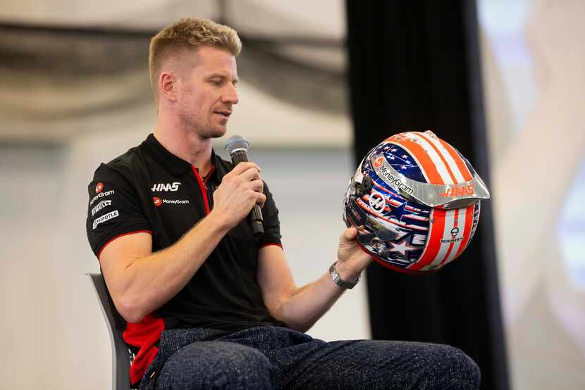 Moneygram Haas F1 Team driver Nico Hulkenberg talks about his helmet as the team speaks to...