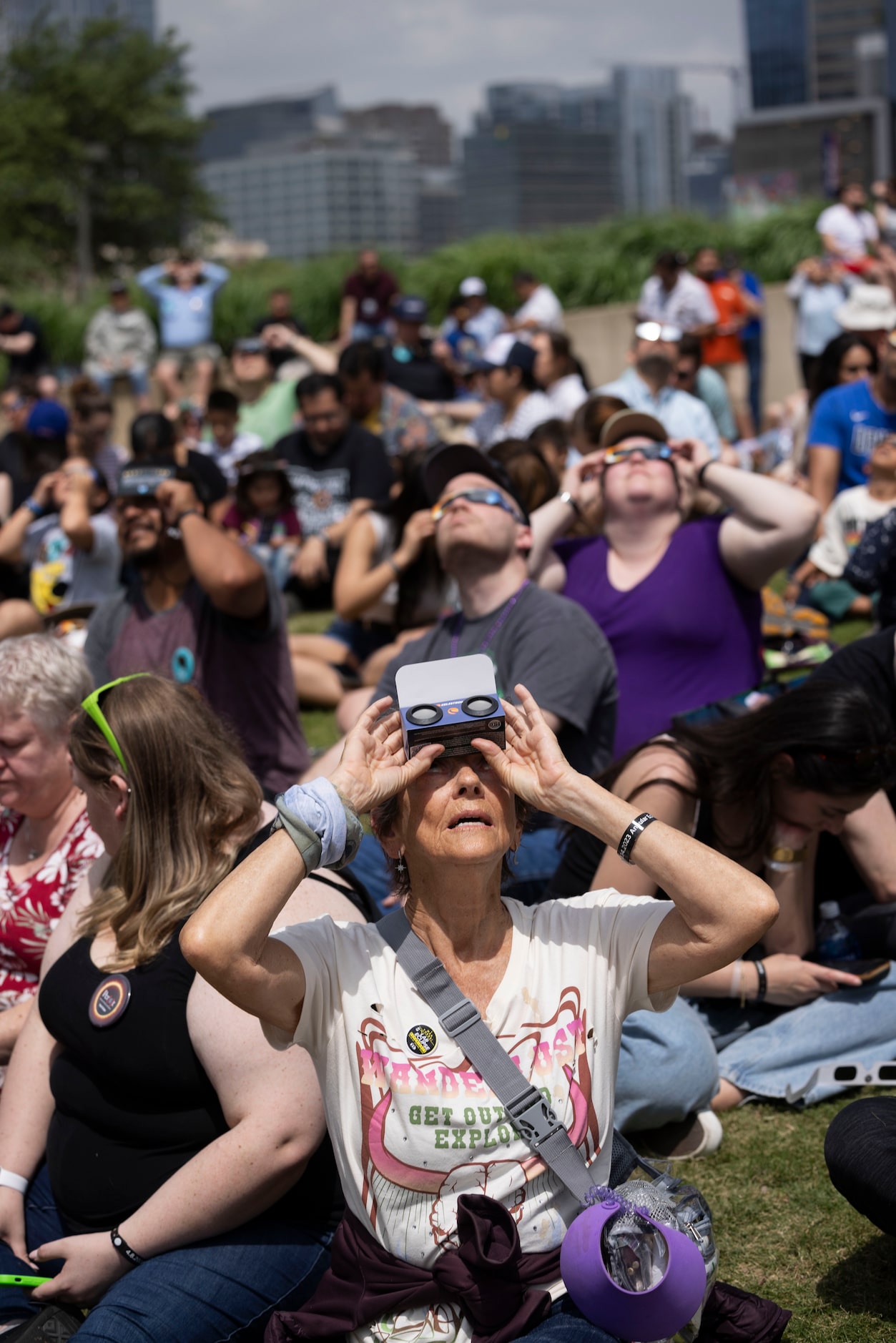 Dianne Nielson of California looks up as the eclipse nears totality during the Great North...