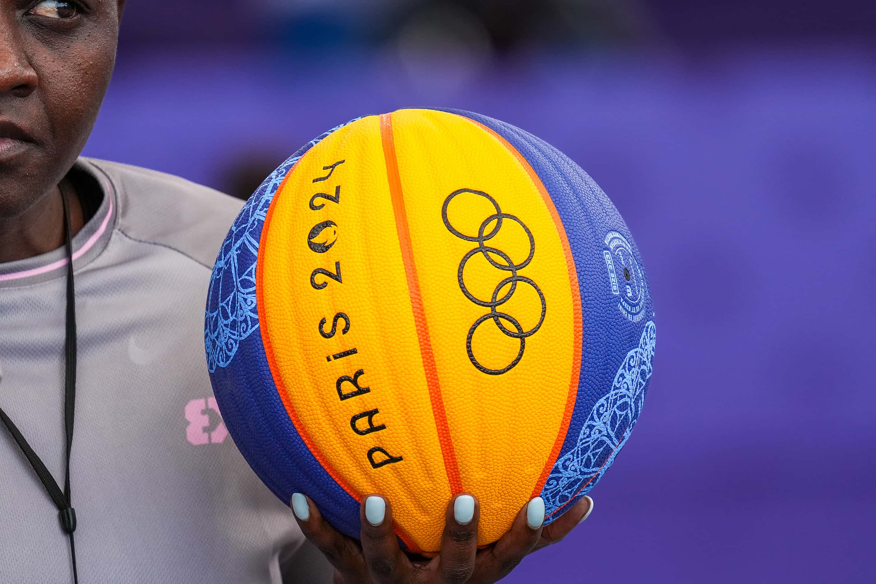 Referee Dorothy Okatch of Botswana holds the game ball before a women’s 3x3 basketball game...