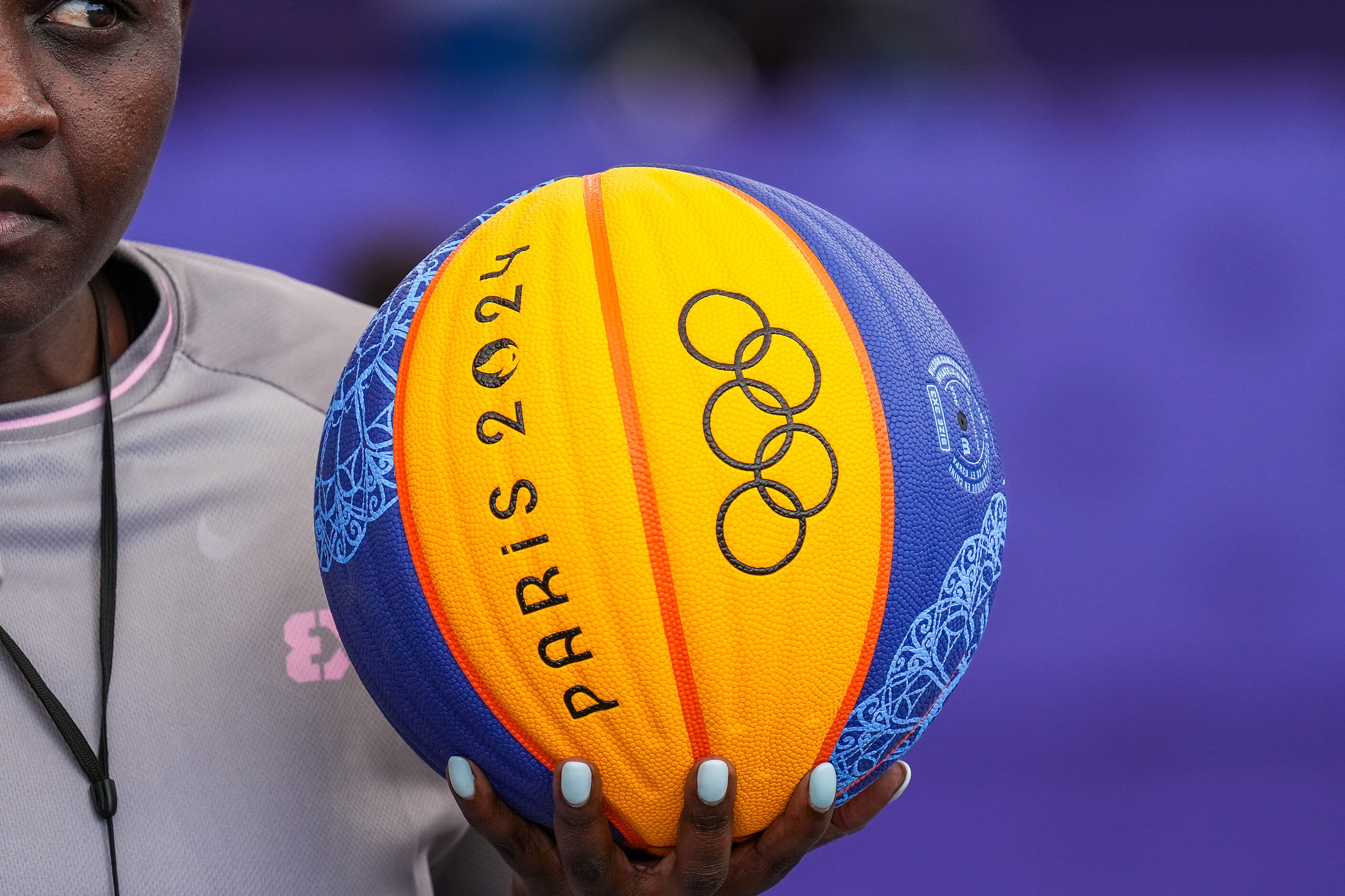 Referee Dorothy Okatch of Botswana holds the game ball before a women’s 3x3 basketball game...