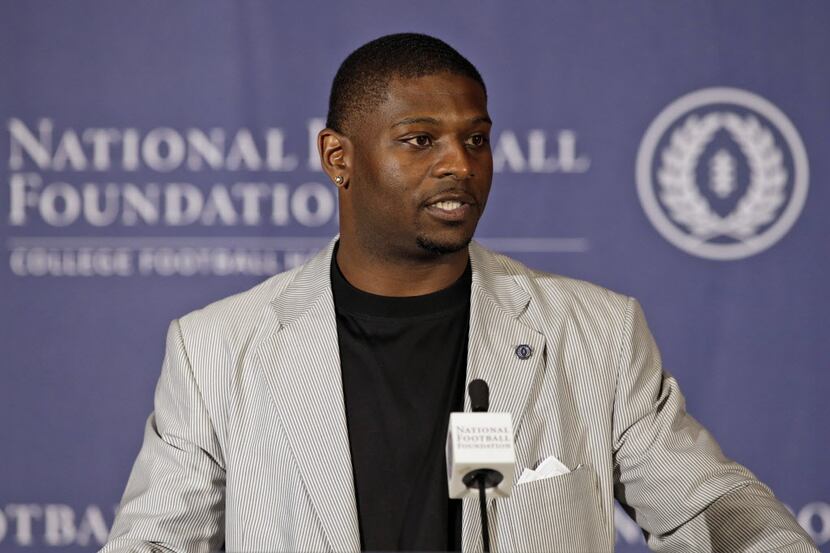 Forme TCU tailback LaDainian Tomlinson makes remarks after being introduced at a news...