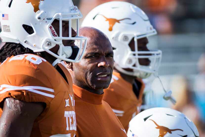 Texas head coach Charlie Strong watches the teams warm up before the 2015 Red River Showdown...