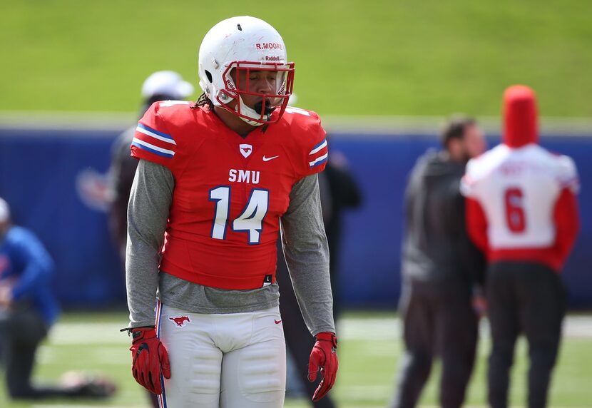 Southern Methodist Mustangs linebacker Richard Moore (14) walks on the field before Southern...