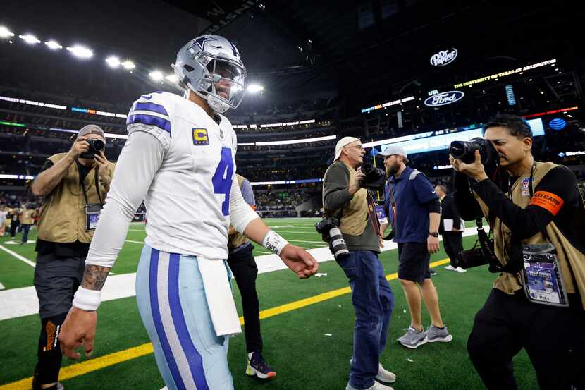 Dallas Cowboys quarterback Dak Prescott (4) walks to the locker room following their Wild...