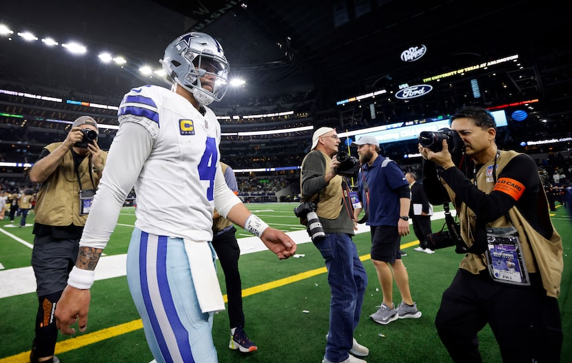 Dallas Cowboys quarterback Dak Prescott (4) walks to the locker room following their Wild...