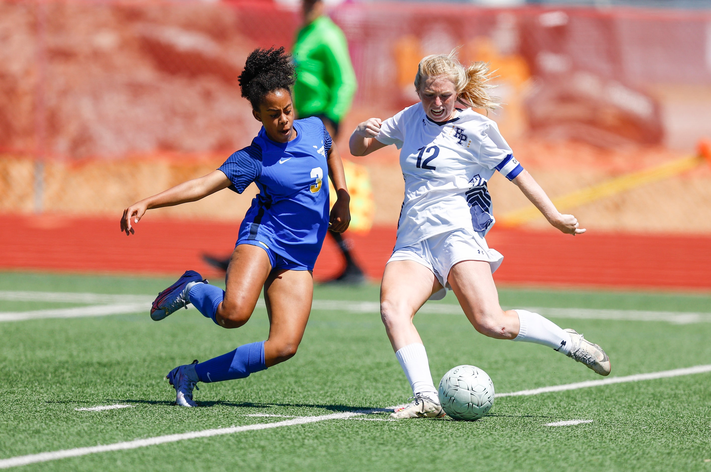 Frisco’s Maiya Haliburton (3) and Highland Park’s Kylie Bell (12) battle for the ball during...