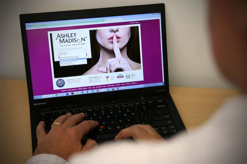 The Ashley Madison website was hacked, and user data was made public. (Photo by Carl...