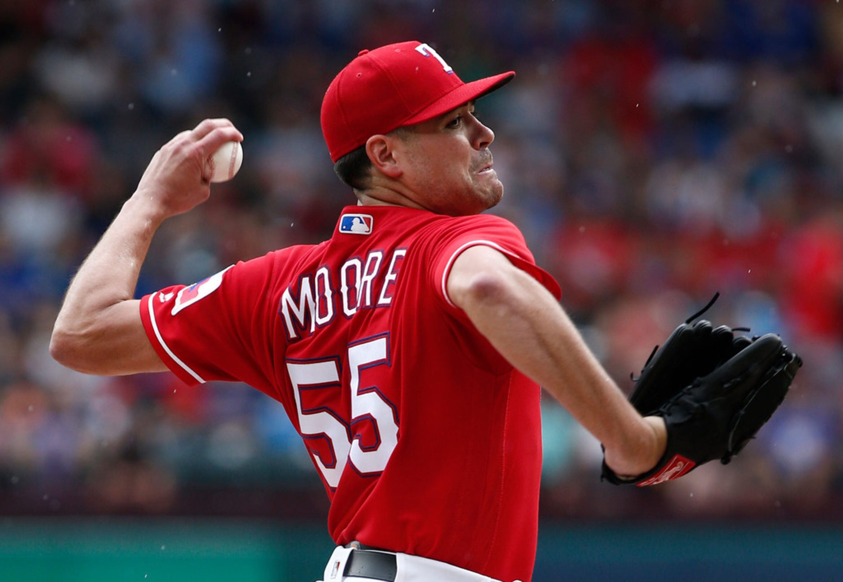 Texas Rangers pitcher Matt Moore (55) delivers against the Los Angeles Angels during the...