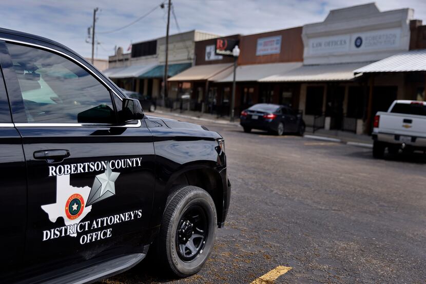 A Robertson County district attorney's office vehicle was parked outside the courthouse in...