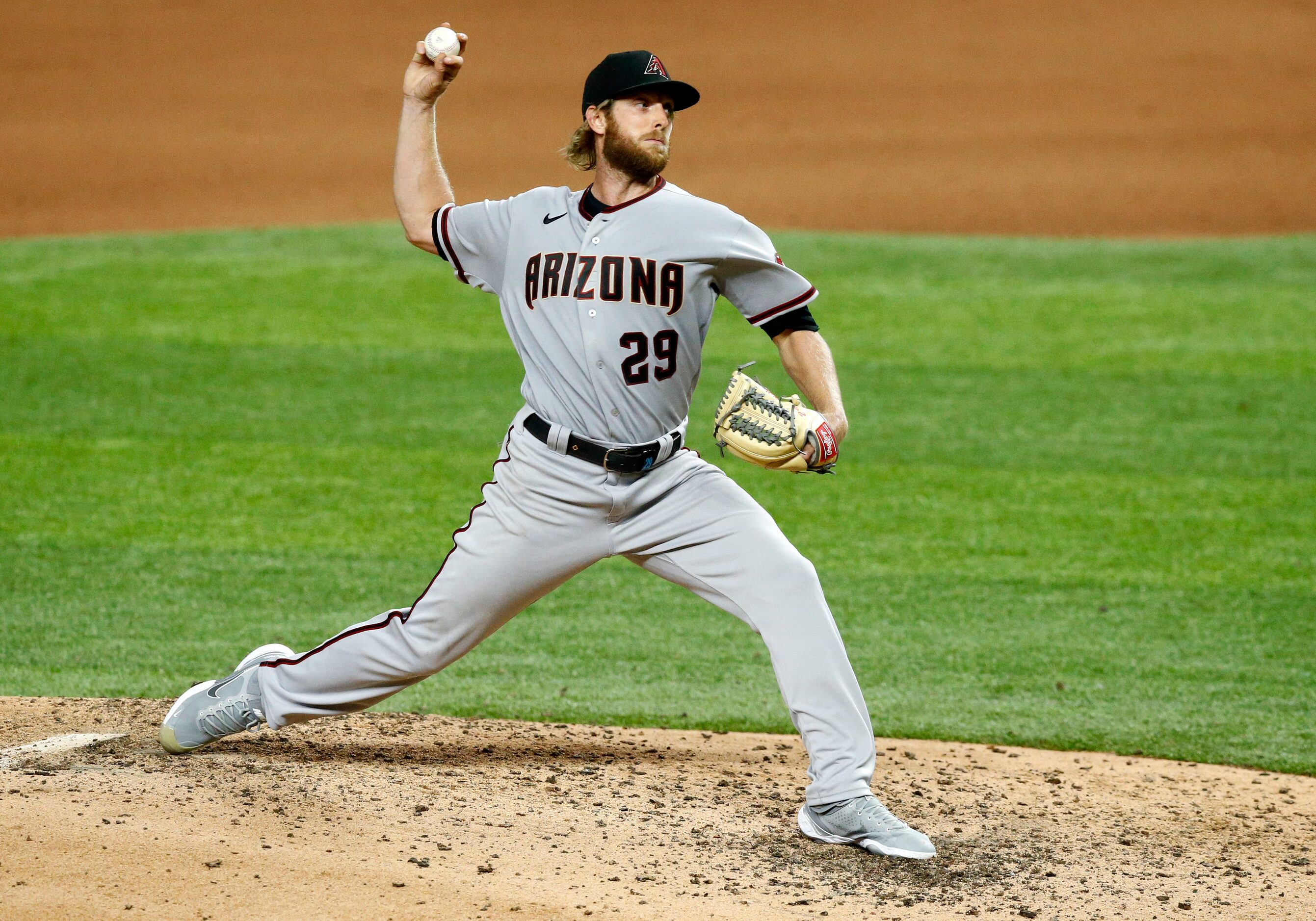 Arizona Diamondbacks starting pitcher Merrill Kelly (29) throws against the Texas Rangers ...