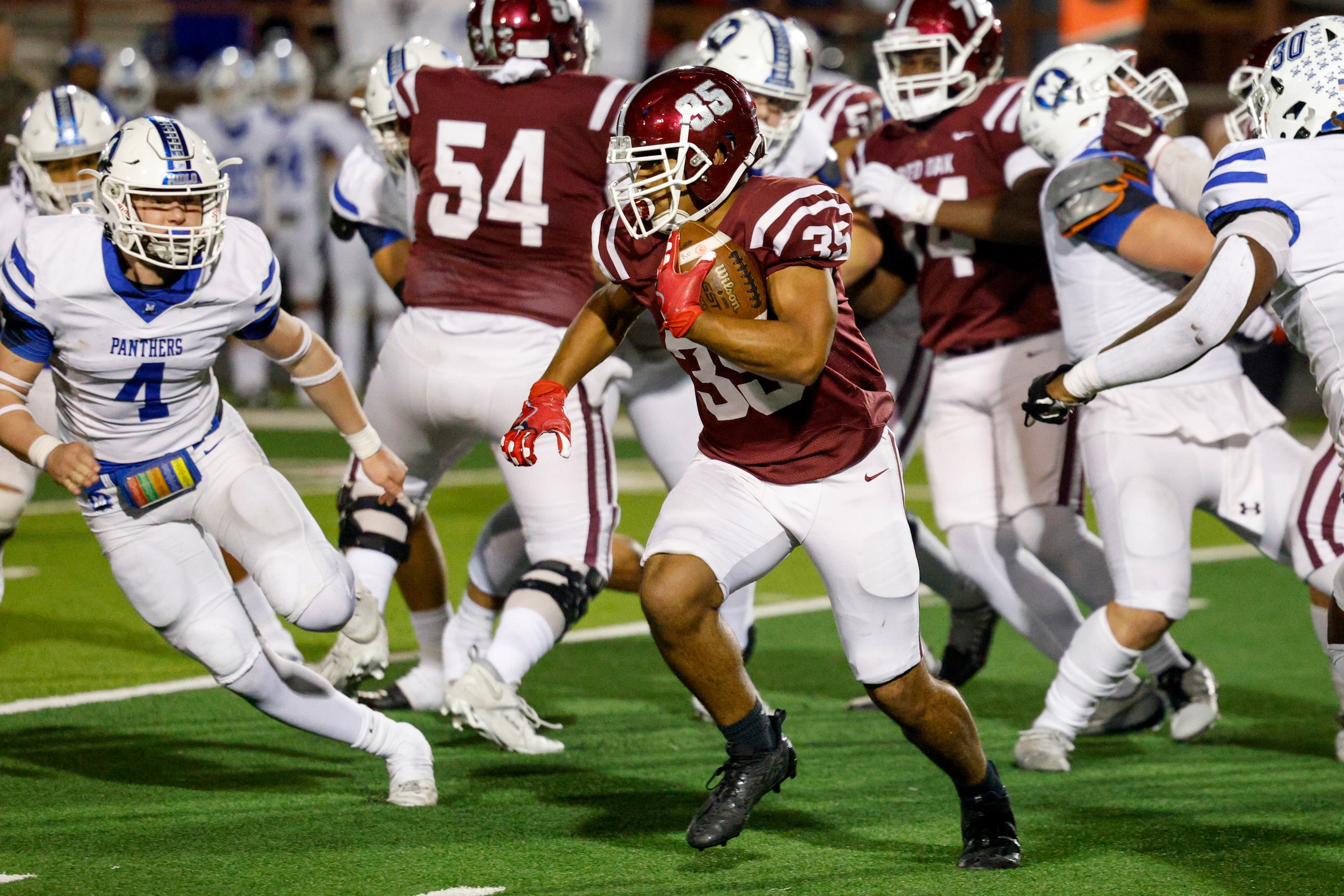 Red Oak running back Lozeno Holman (35) runs the ball during the second half of a UIL...