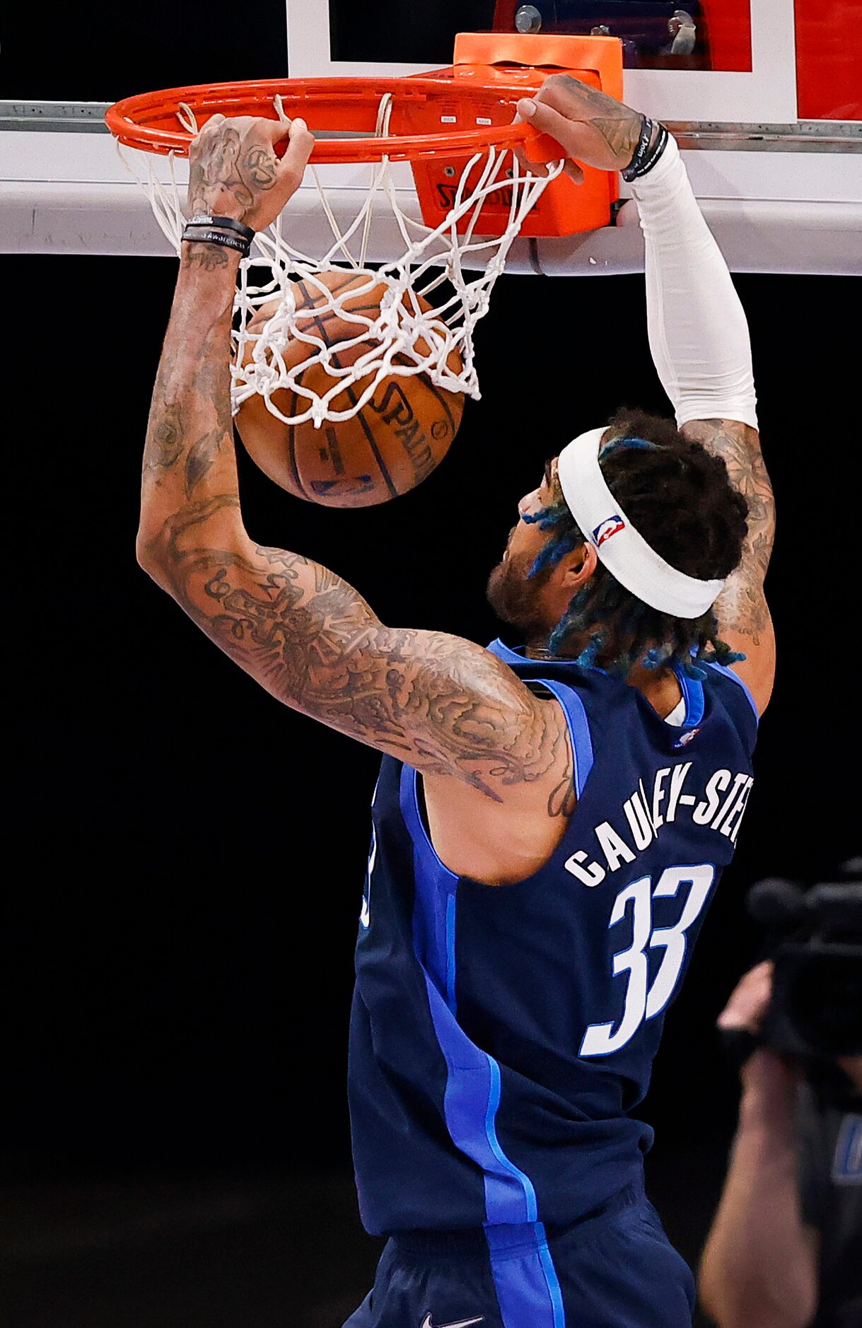 Dallas Mavericks center Willie Cauley-Stein (33) flies to the rim with a fourth quarter dunk...