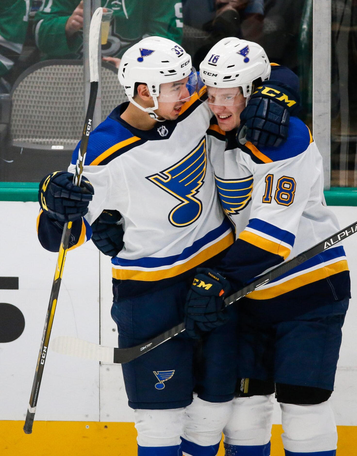 St. Louis Blues center Jordan Kyrou (33) and center Robert Thomas (18) celebrate a goal...