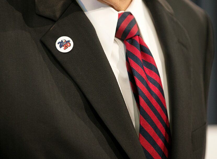 Lt. Gov. Dan Patrick wears one of the "20 for 20" pins Gov. Greg Abbott has been...