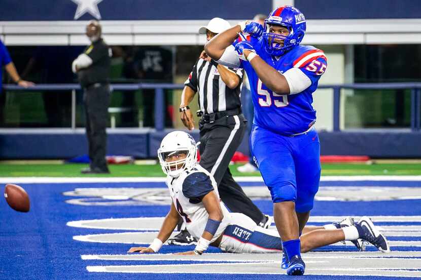 Duncanville defensive lineman De'Braylon Carroll (55) flexes in celebration after sacking...