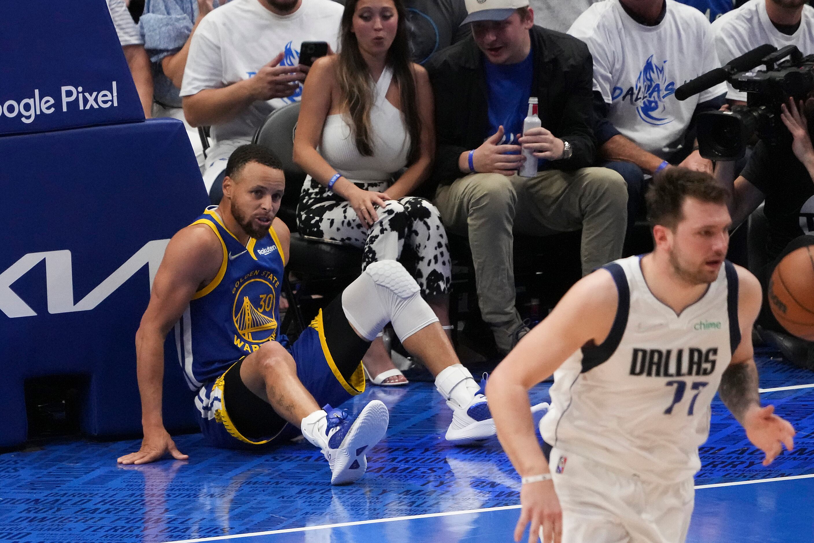 Golden State Warriors guard Stephen Curry (30) gets up from the floor after missing a shot...