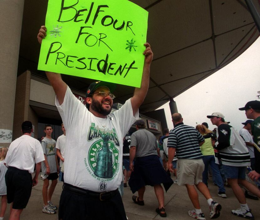 Sam Salas of Fort Worth thinks Eddie Belfour would make a great president. Holding a sign...