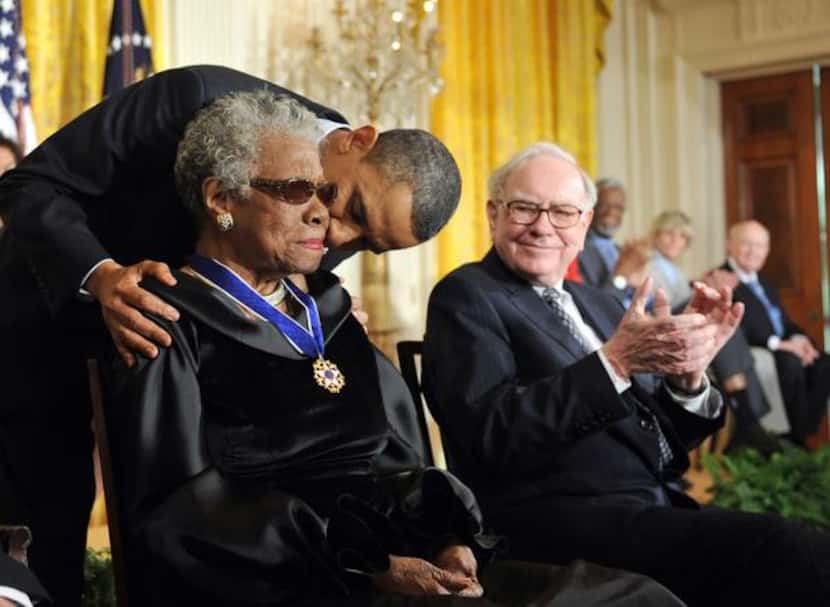 
President Barack Obama kissed Maya Angelou after presenting the Presidential Medal of...