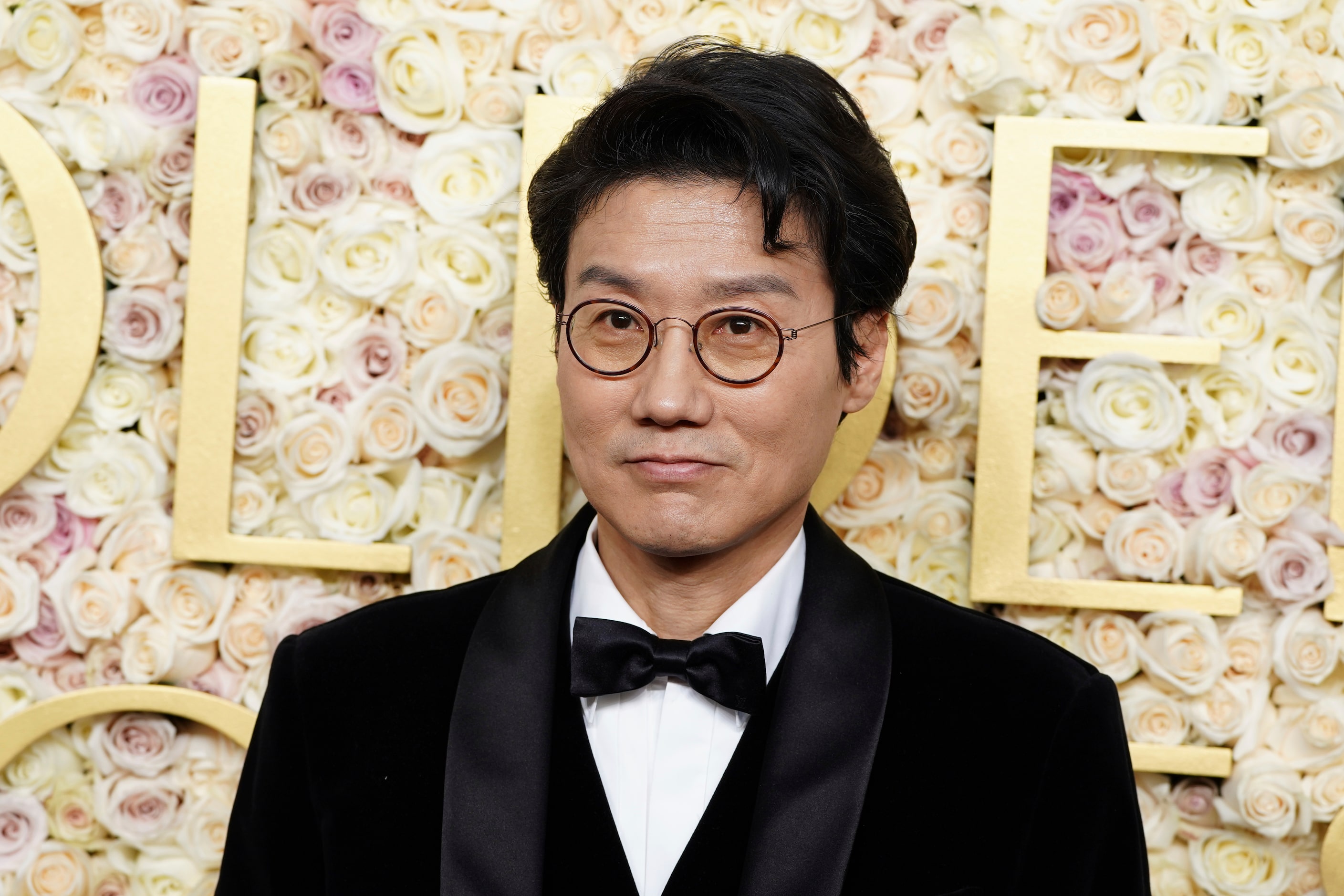 Hwang Dong-hyuk arrives at the 82nd Golden Globes on Sunday, Jan. 5, 2025, at the Beverly...