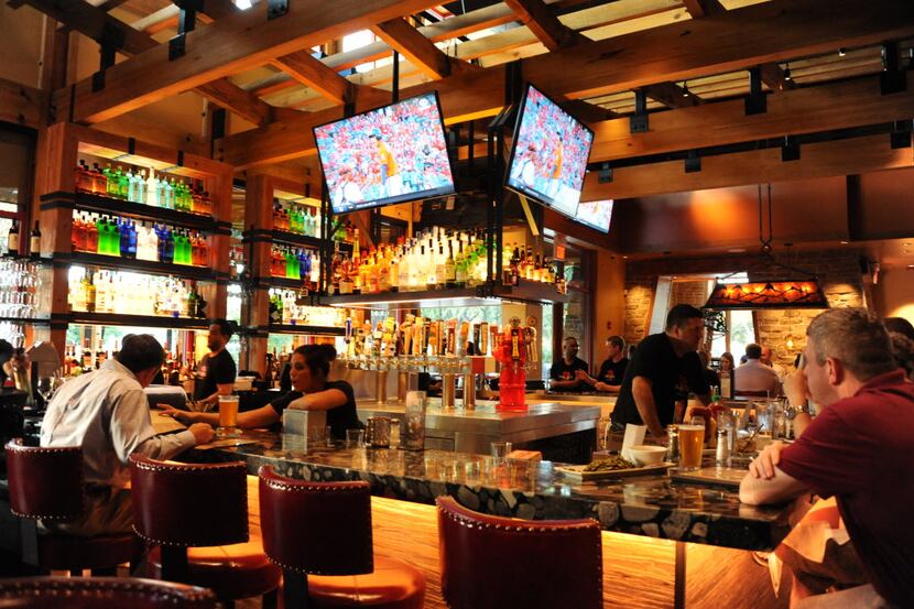 Specialty cocktails, beer, and wine is served at the bar at Lazy Dog Restaurant & Bar in...