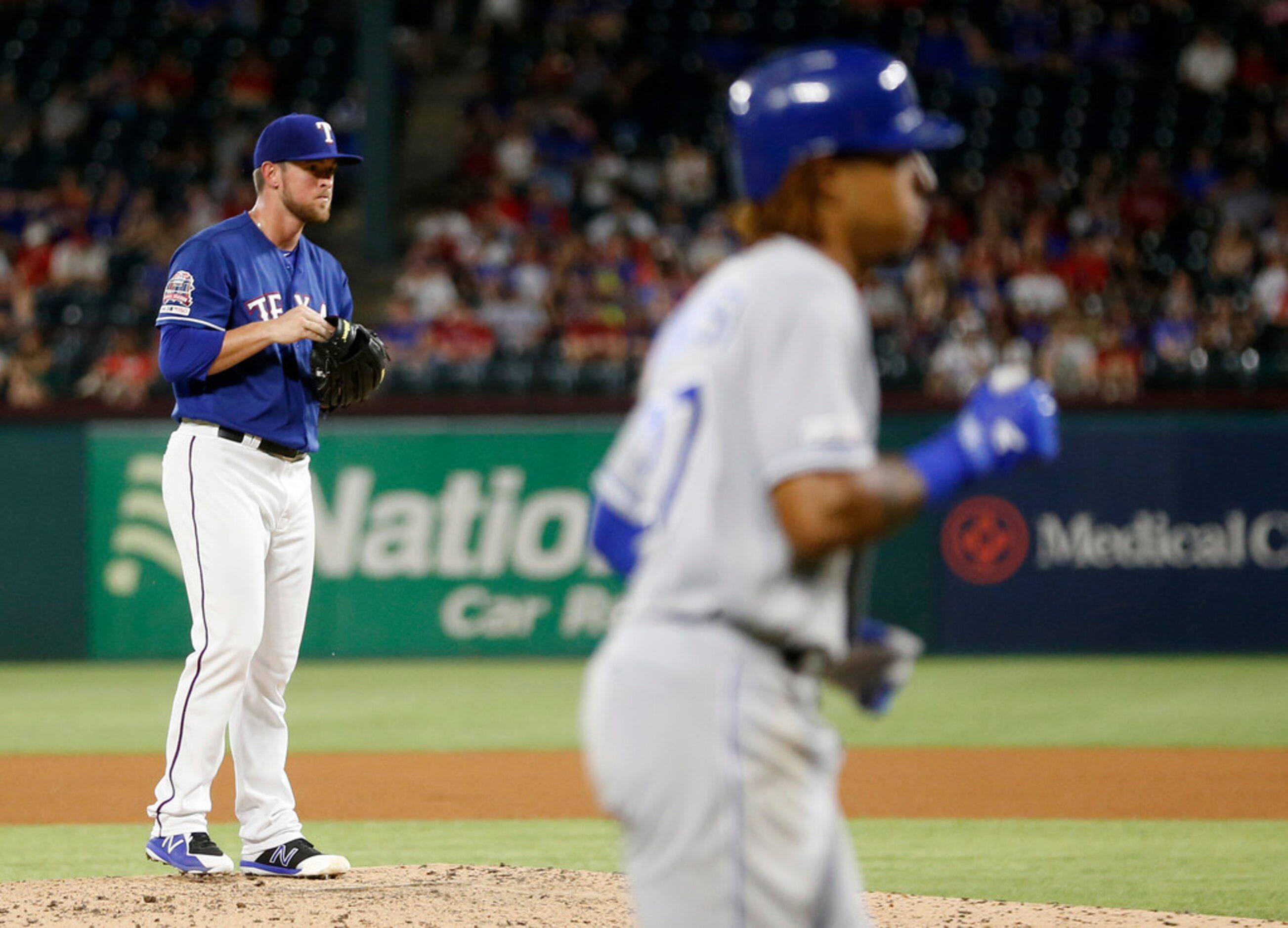 Texas Rangers relief pitcher Jeffrey Springs (54) watches as Kansas City Royals second...