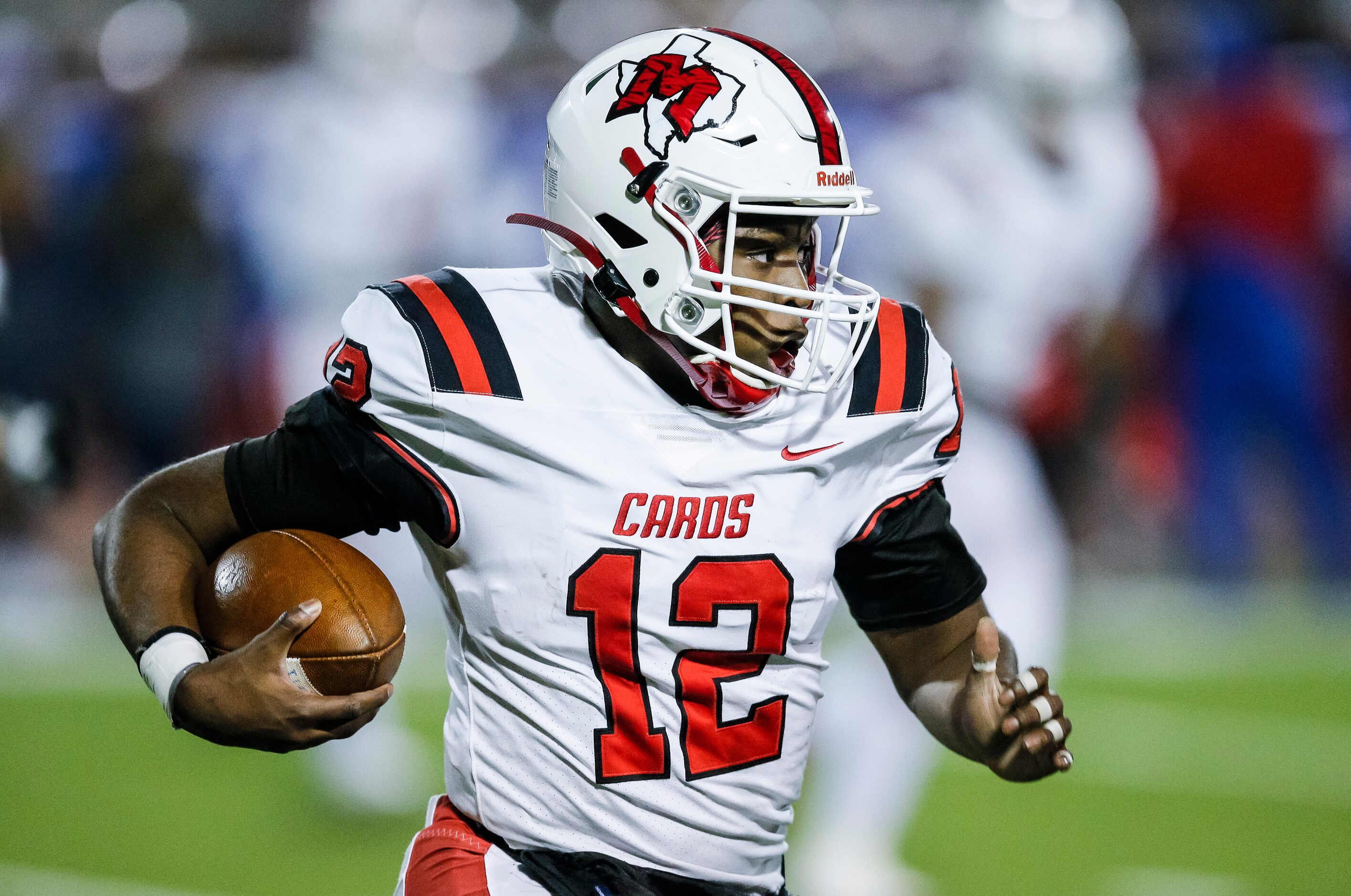 Irving MacArthur sophomore quarterback Kylale Flye (12) carries the ball during the first...