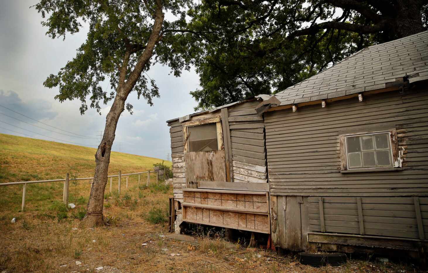 A boarded up home at 810 Millard Street sits vacant along the Trinity River west levee near...