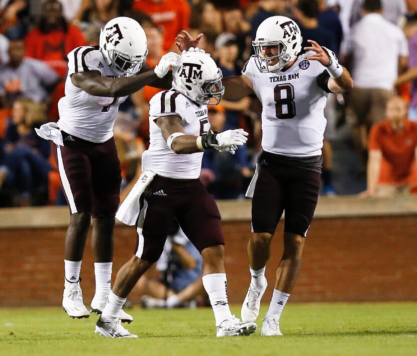 Texas A&M running back Keith Ford, left, running back Trayveon Williams, center, and...