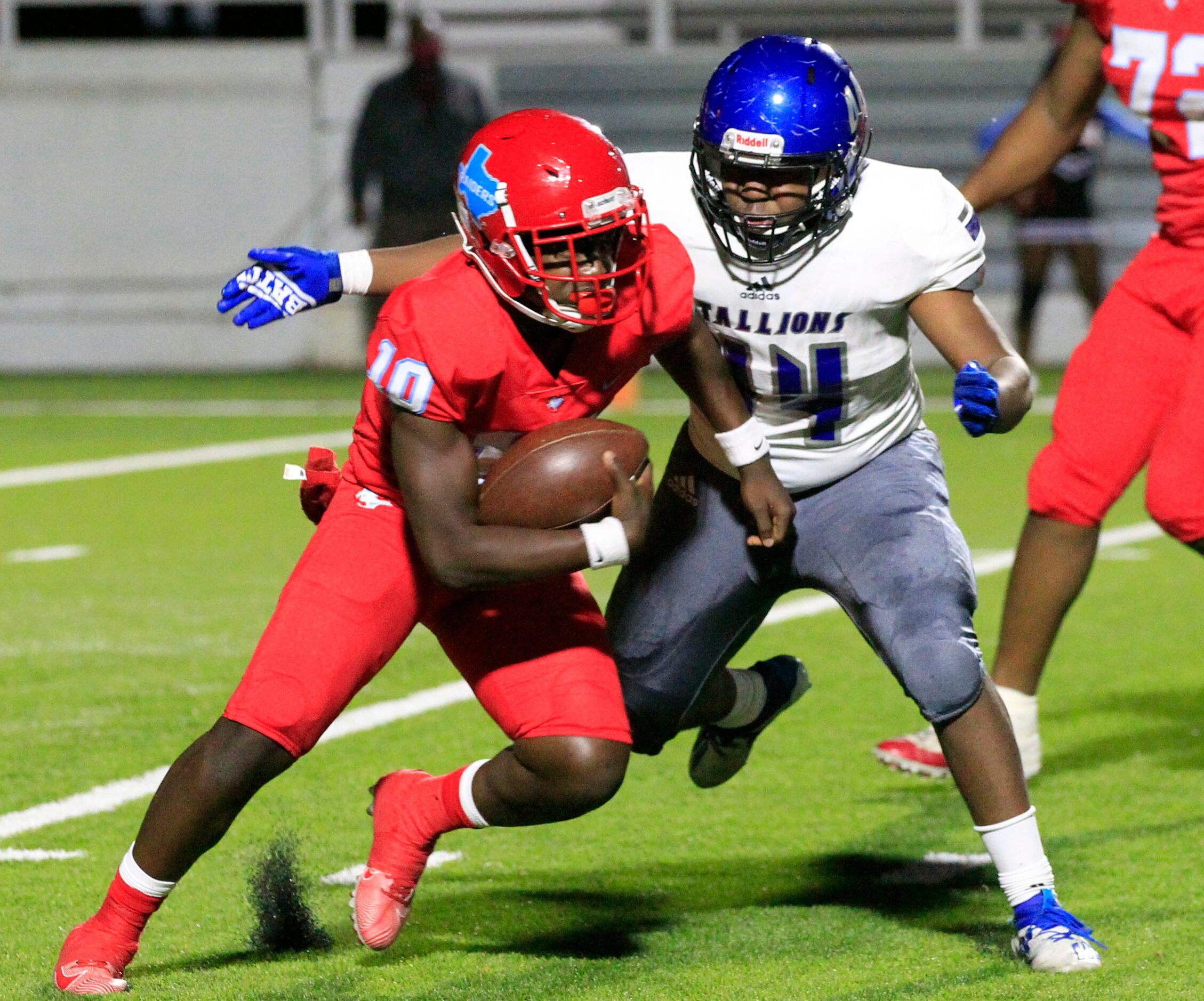 North Mesquite defender Casey Edwards (44) chases down Skyline? QB Jaylon Robinson (10)...