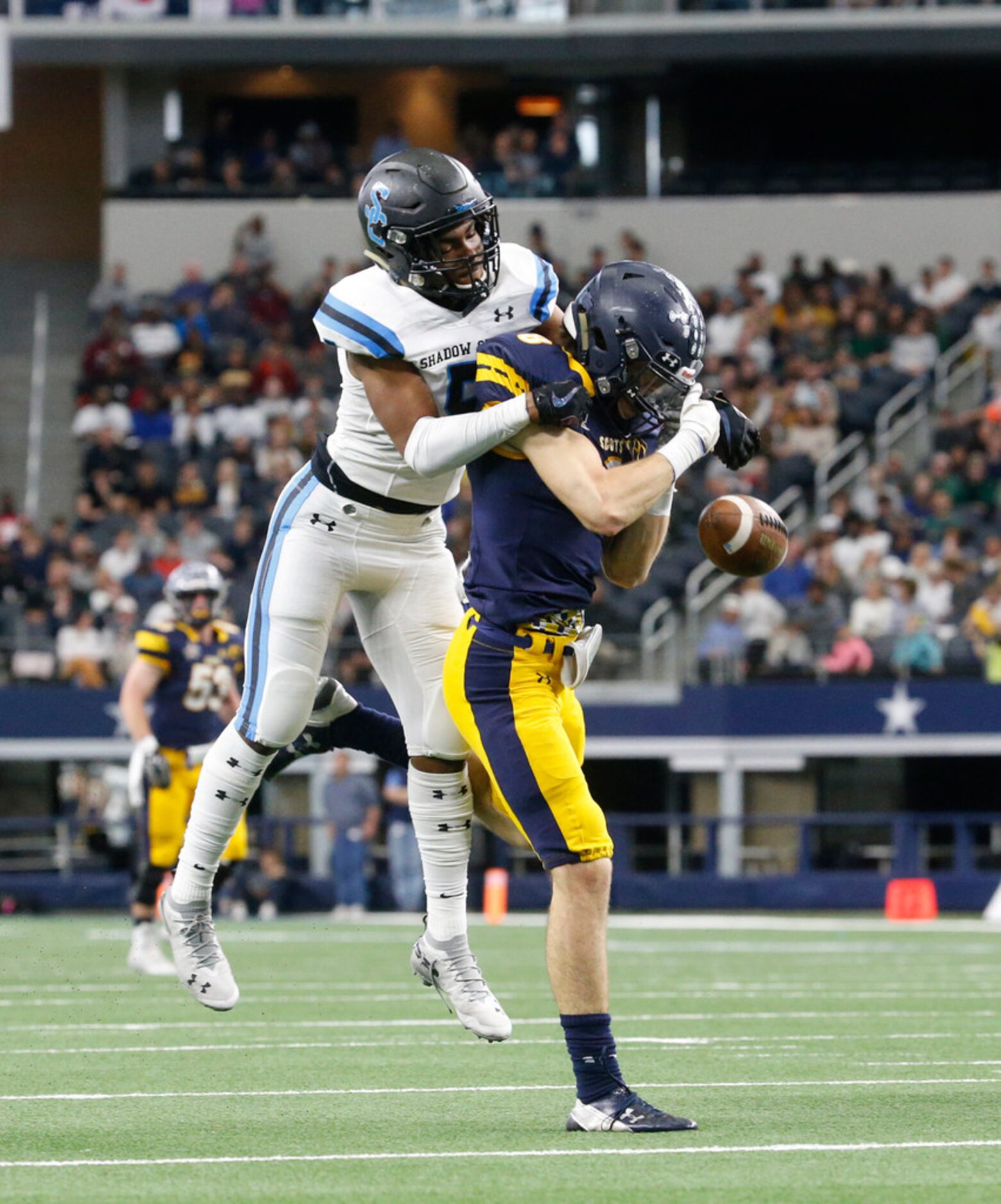 Shadow Creek's Jevin Murray (5) breaks up a pass intended for Highland Park's  Bennett Brown...