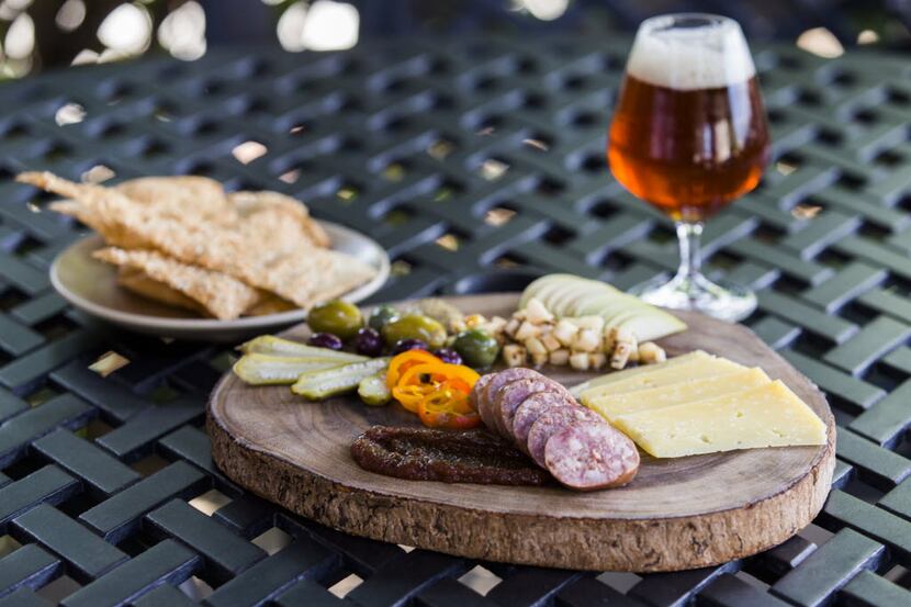 A charcuterie plate and Lakewood Hop Trapp beer on Wednesday, August 31, 2016 at Wayward...