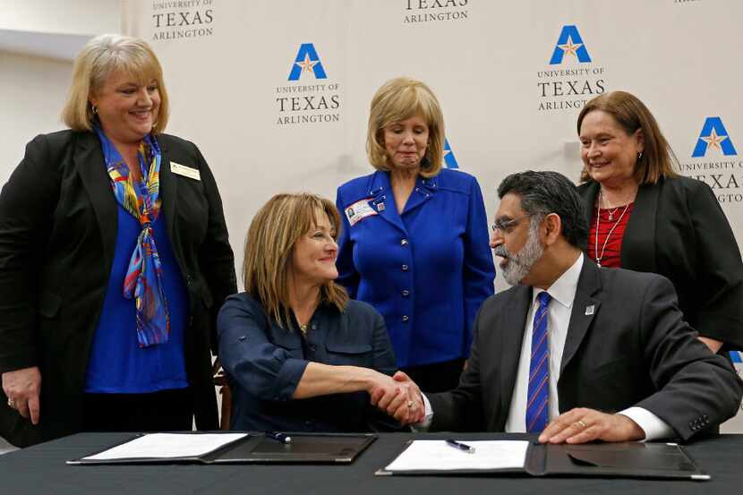 Grand Prairie ISD Superintendent Dr. Susan Simpson Hull (left) shakes hands with Dr. Vistasp...