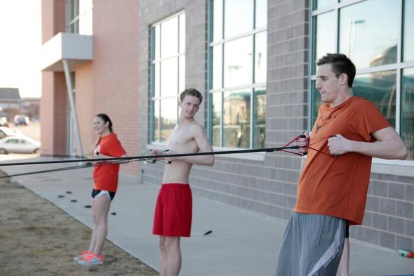 
Rockwall swimmers (from left) Raena Eldridge and William Rapp and Rockwall-Heath swimmer...