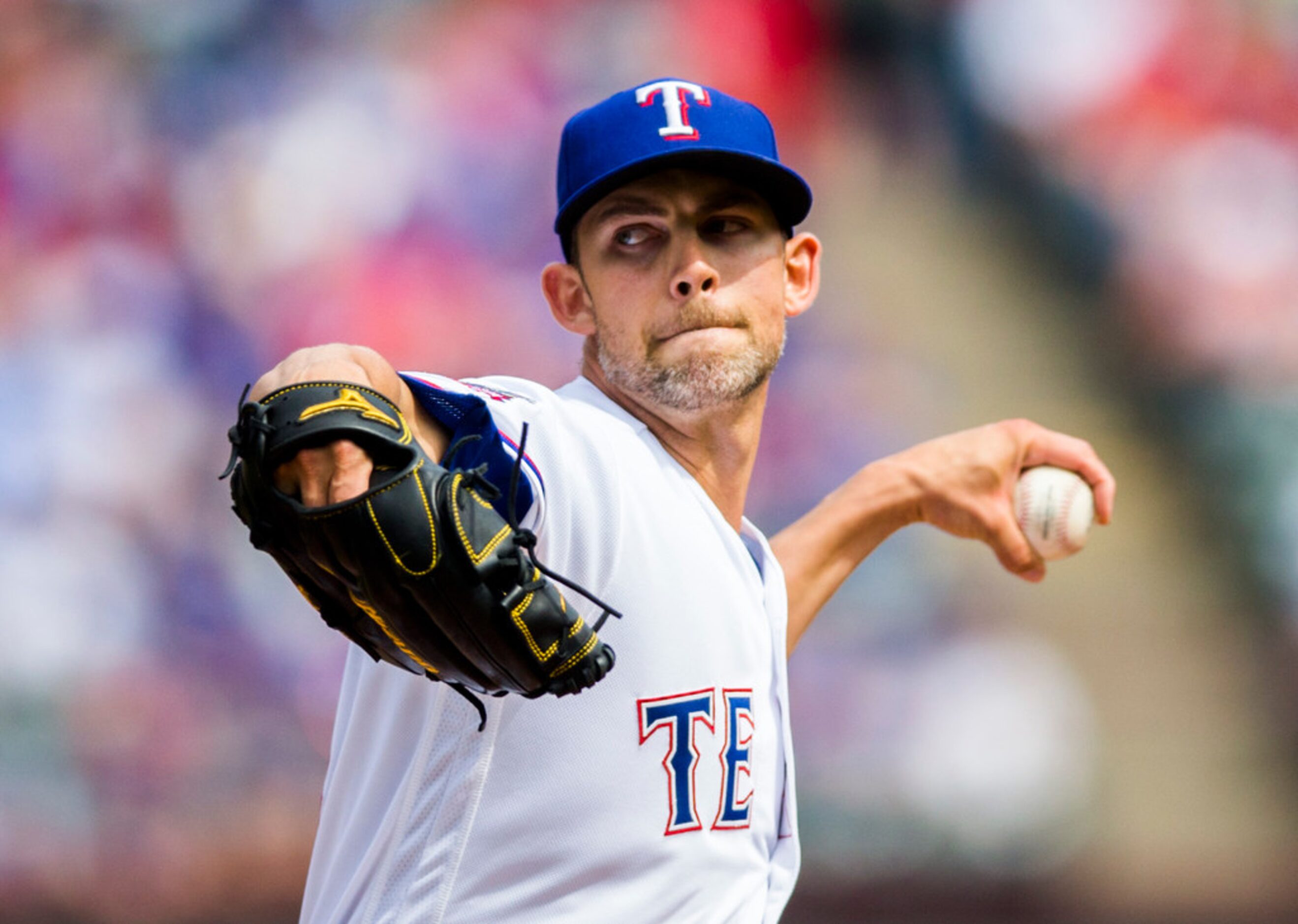 Texas Rangers starting pitcher Mike Minor (23) pitches during the first inning of an opening...