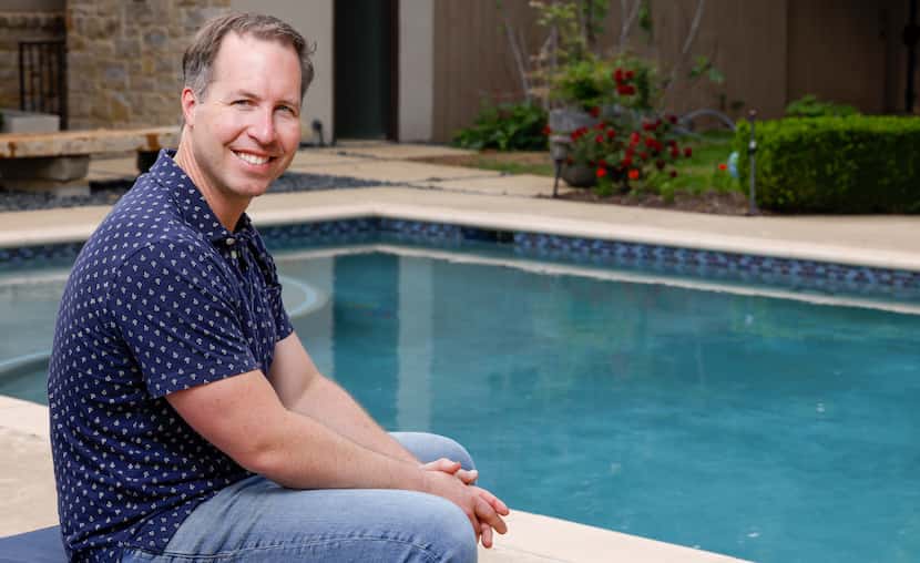 Entrepreneur Ben Kohlmann sits by his backyard pool for a portrait in Dallas on April 10....