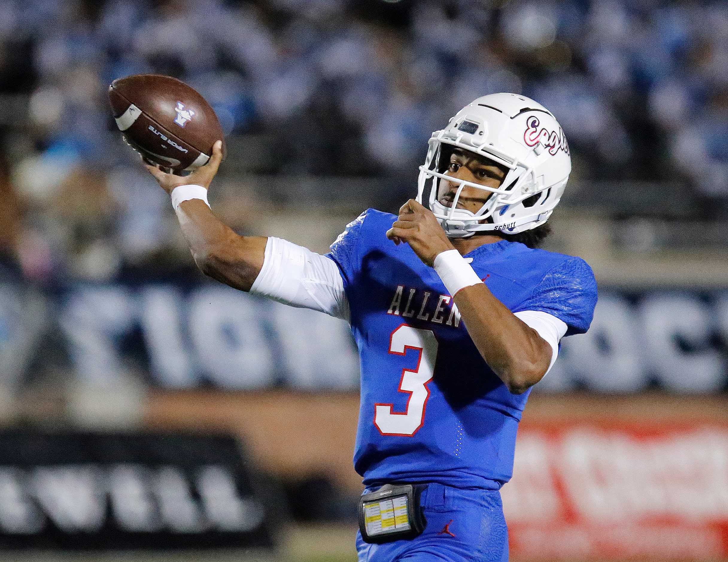 Allen High School quarterback Mike Hawkins (3) throws a touchdown pass during the first half...