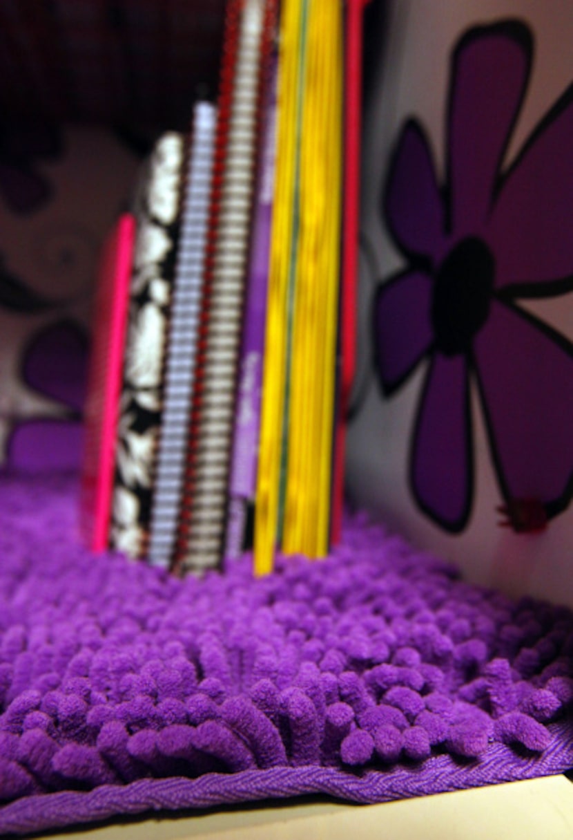 Books sink in to the carpet in Sierra Leong's locker at Prestonwood Christian Academy.