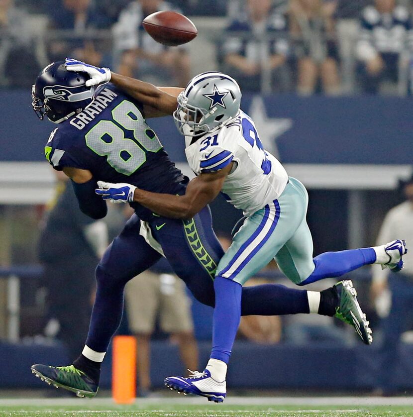 Dallas Cowboys cornerback Byron Jones (31) breaks up a pass meant for Seattle Seahawks tight...