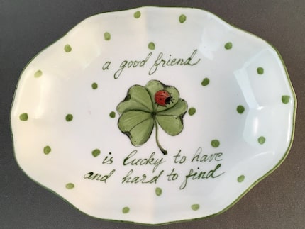 Set a pretty trinket dish, like this one by Ann Marie Murray, by the bed or on a dresser to...