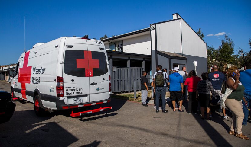 A Red Cross vehicle drove into the tornado-damaged Southwind Apartments on Wednesday,...