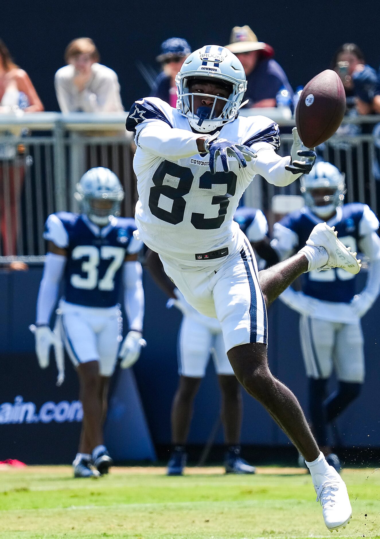 Dallas Cowboys wide receiver Jalen Brooks (83) reaches for a pass during a training camp...