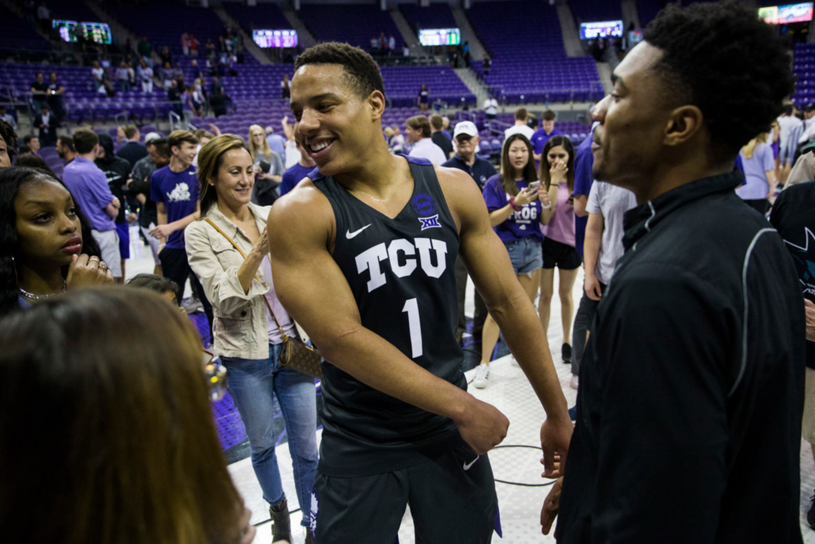 TCU Horned Frogs guard Desmond Bane (1) celebrates after fans rush the court because of a...