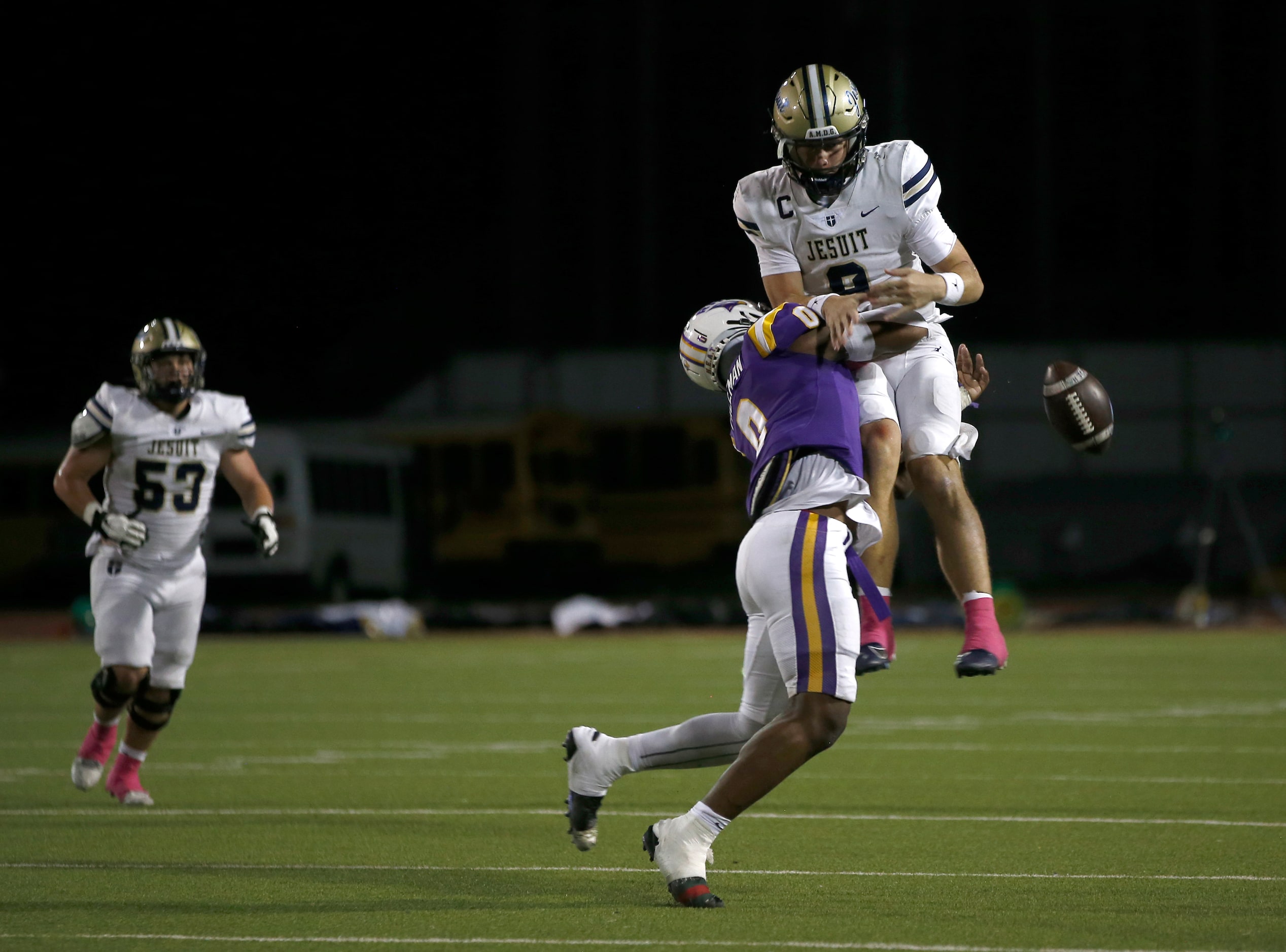 Jesuit quarterback Charlie Peters (9) is unable to make the catch on a double pass as...