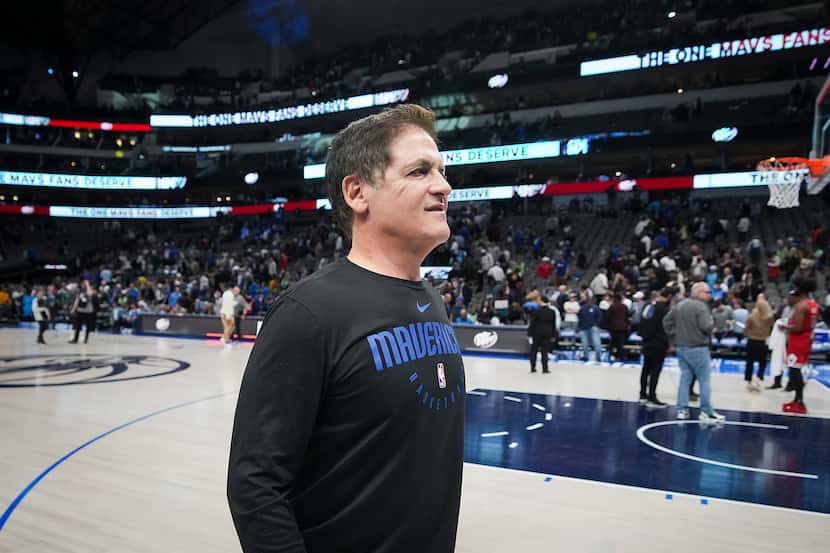Dallas Mavericks owner Mark Cuban leaves the court after a loss to the Chicago Bulls in an...