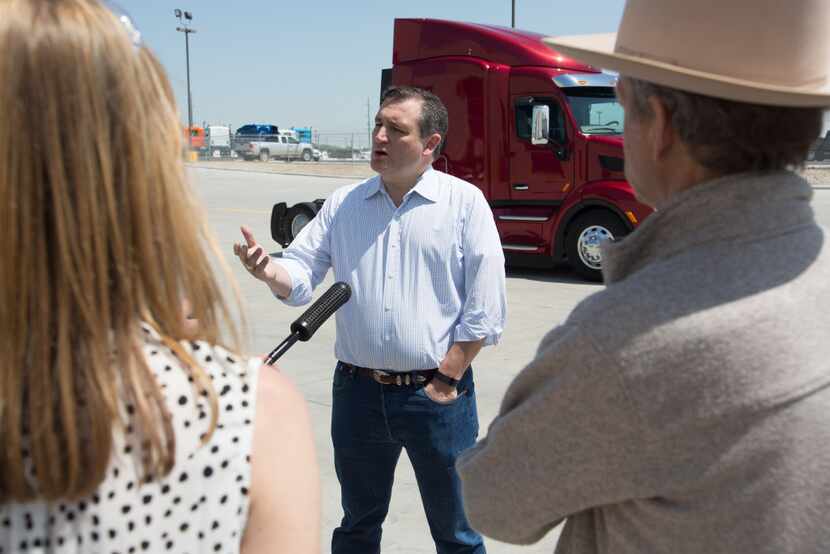 Sen. Ted Cruz spoke talks to reporters during a tour of the Peterbilt Motors Co....