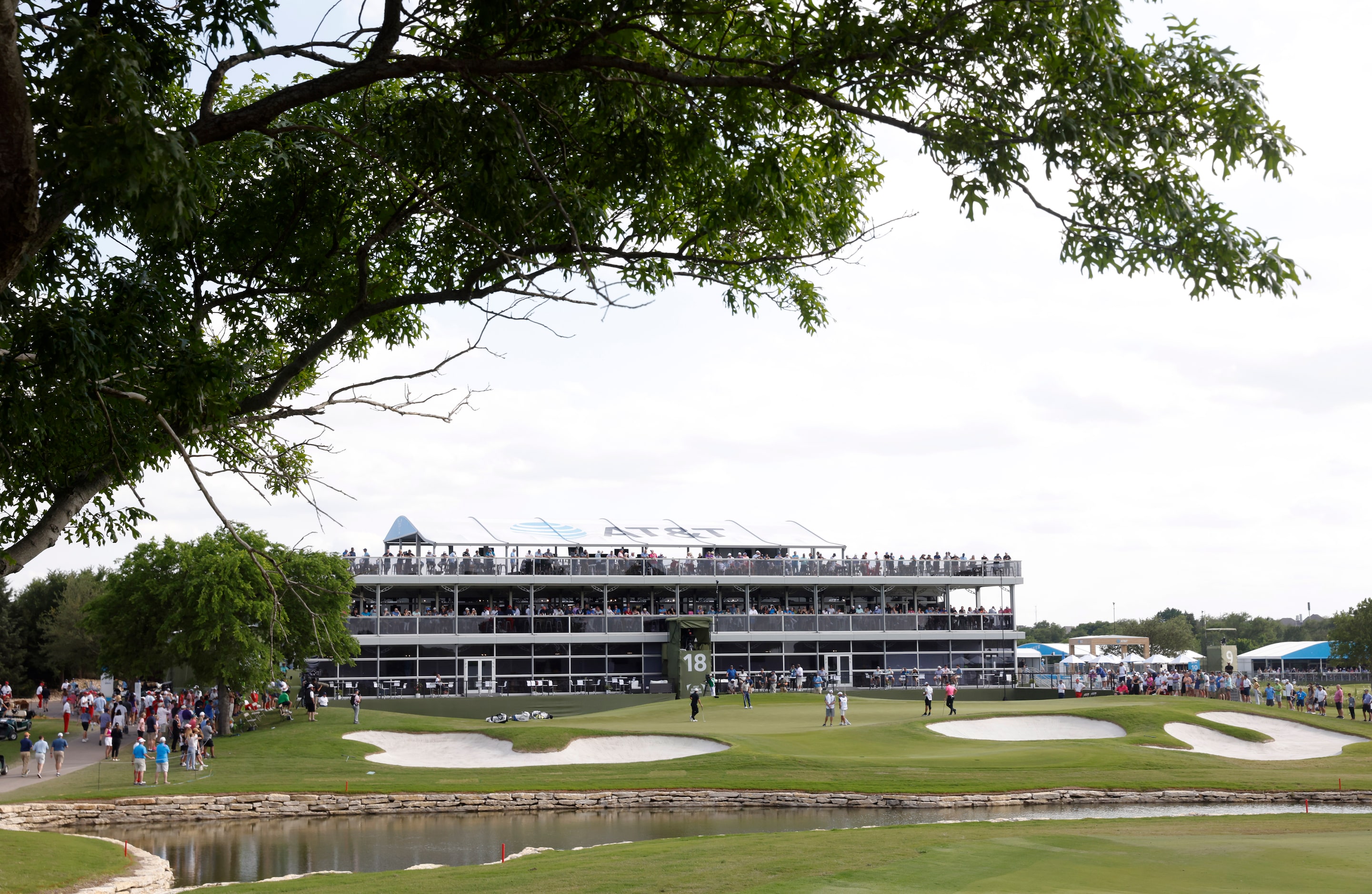 Fans watch action on the 18th hole during round 2 of the AT&T Byron Nelson  at TPC Craig...