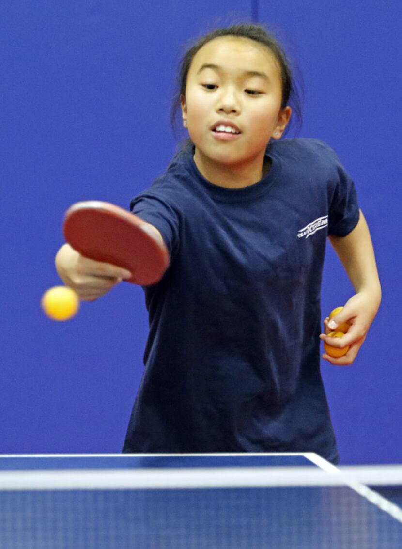 Katie Gao, 10, practiced her backhand during a recent pingpong session at Hua Yi Education...