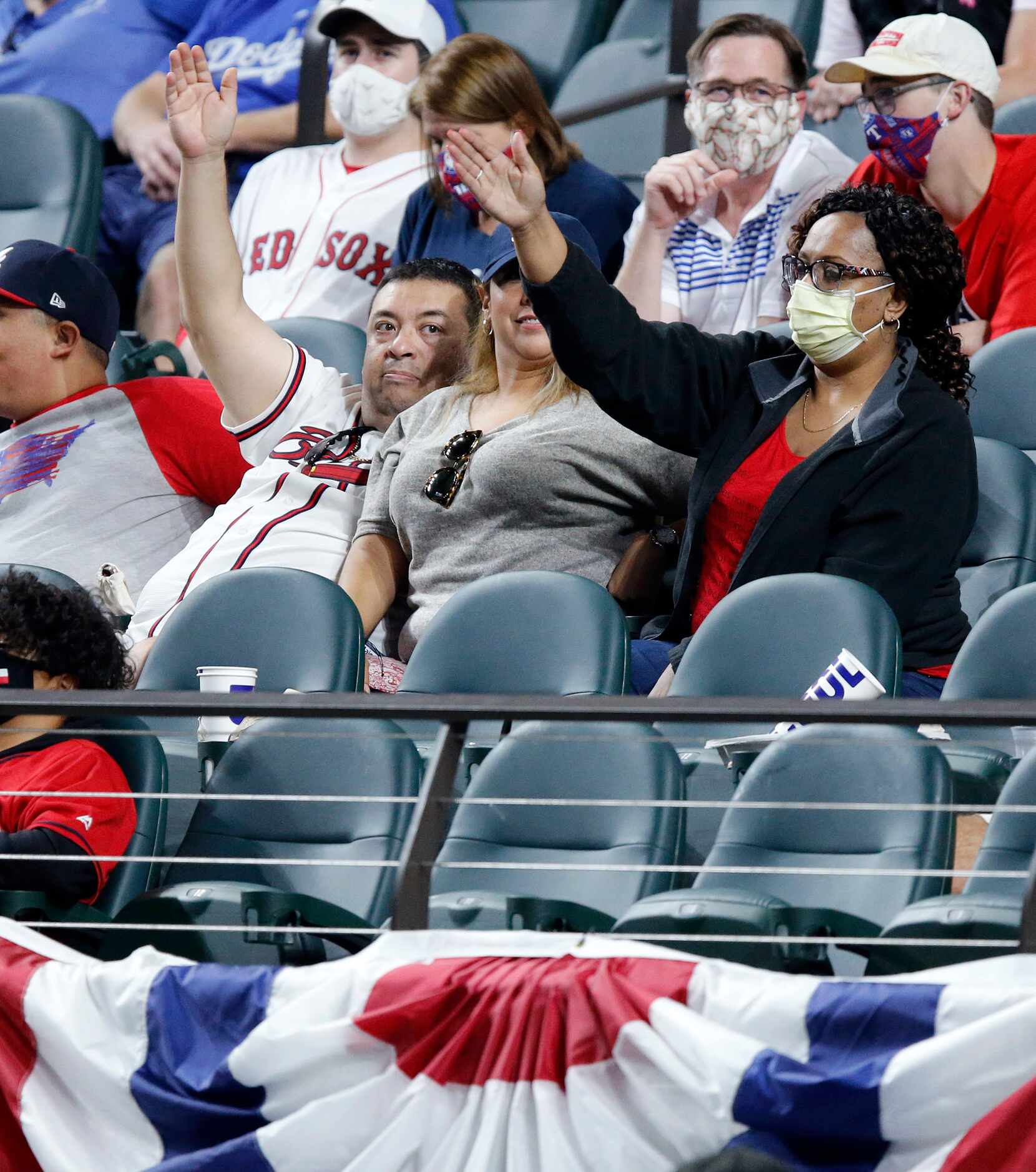 Atlanta Braves fans perform the tomahawk chop as their team faces the Los Angeles Dodgers in...
