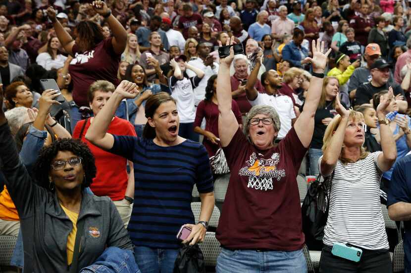 Mississippi State Lady Bulldogs fans celebrate an  overtime victory over the Connecticut...